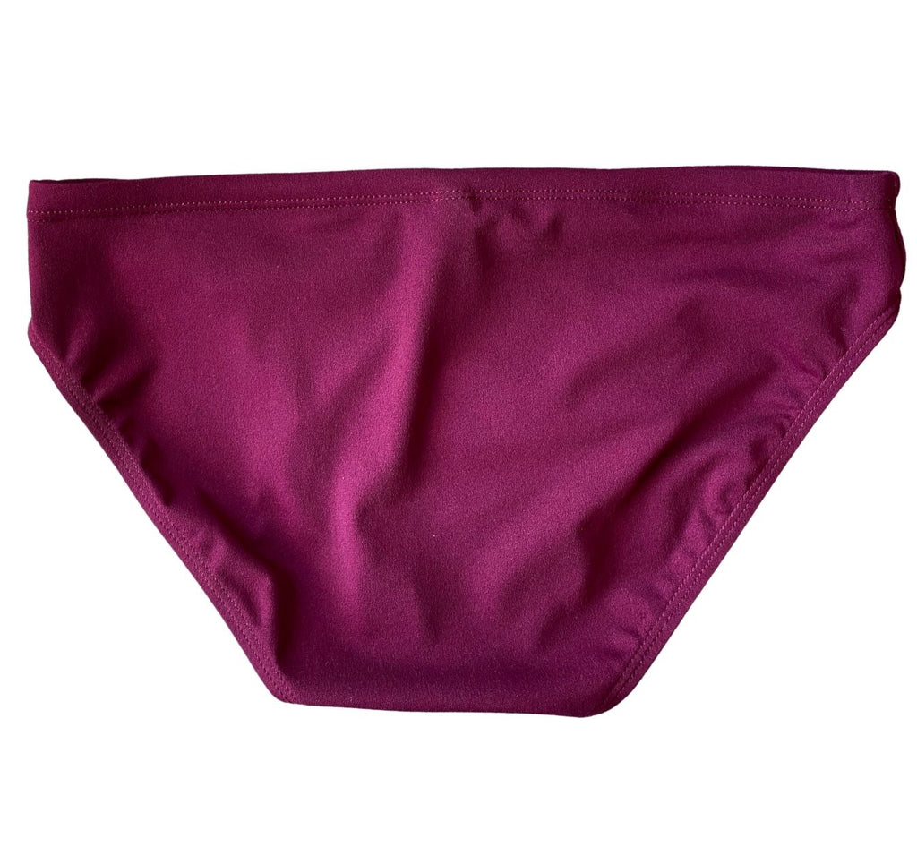 Men's maroon swimsuit from the back. Maroon speedos with maroon stitching in a classic speedo style cut. The shape is rounded to give coverage over the bottom.