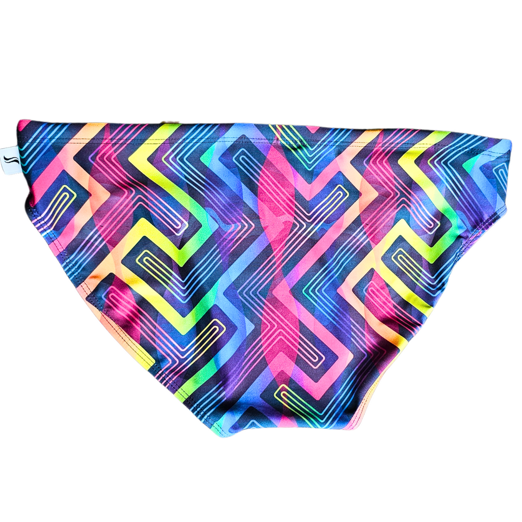 Back view of Smithers men's swimwear 'Rhapsody,' showcasing the sleek silhouette of classic swim briefs. The design features a striking neon drawcord detail at the waist, adding a pop of color against the sleek black base adorned with geometric rainbow accents. Celebrate love, unity, and the vibrant spirit of Pride with this stylish and empowering swimwear.