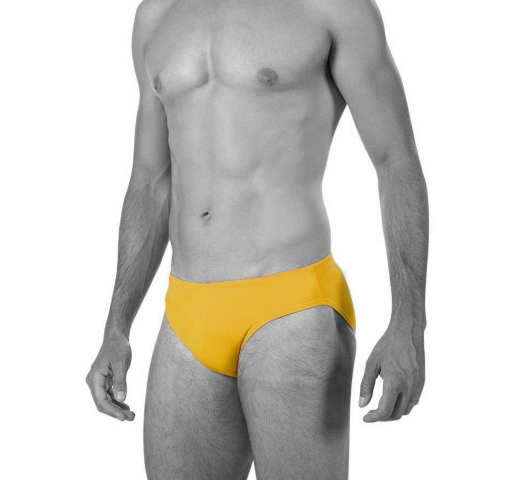 Man wearing Smithers. The swimsuit is a block colour in canary yellow and is a speedo brief cut